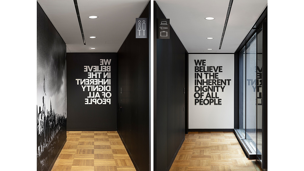 A hallway with a sign on the wall.